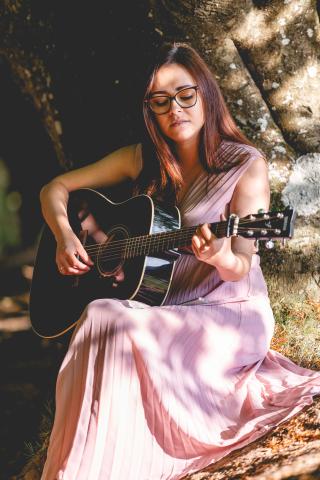 Justyna playing a guitar