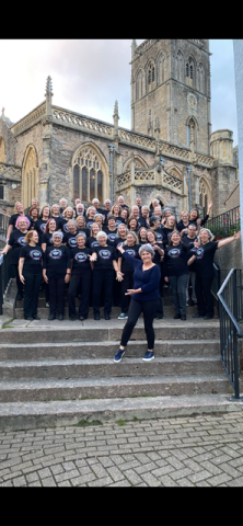Group of people on steps outside a church