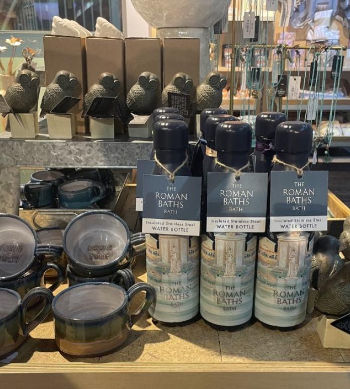 Variety of products - waterbottles, mugs, necklaces