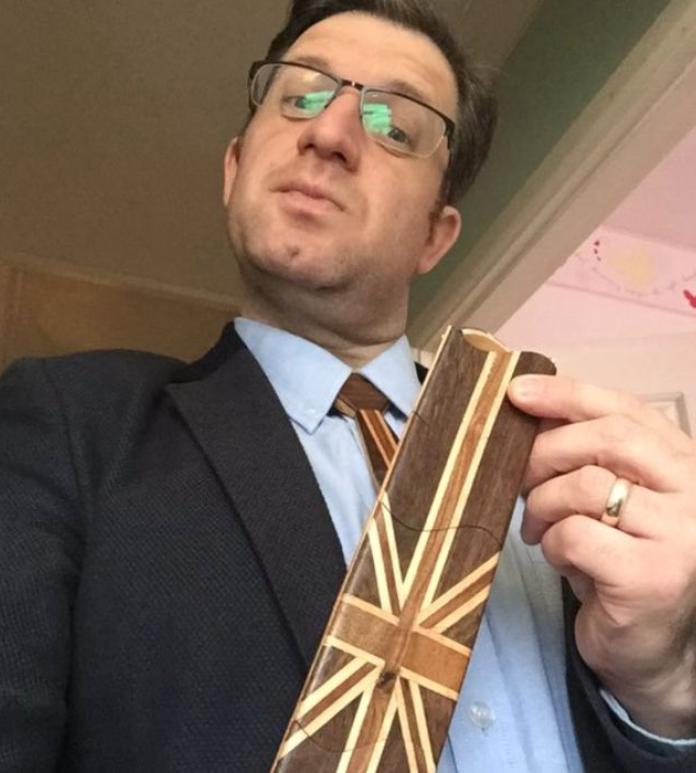 A man wearing a wooden tie