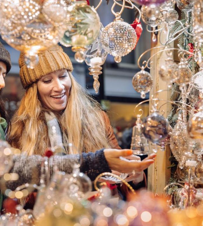 people looking at ornaments