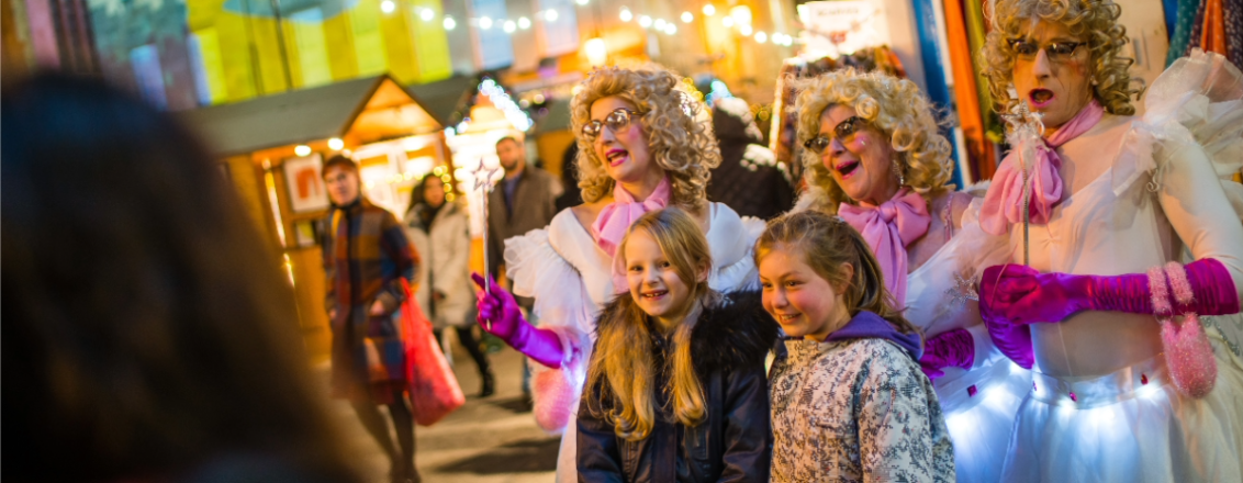 Children with performers in costume 