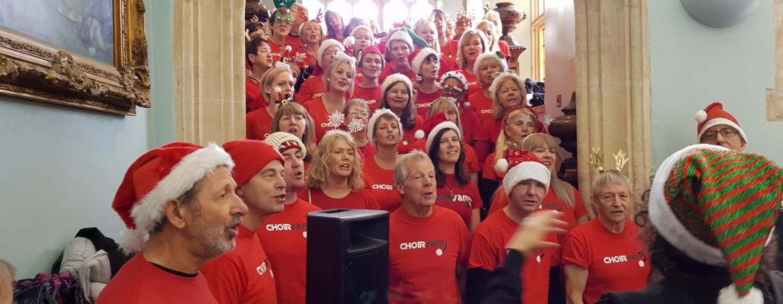 Choir performs in Santa hats