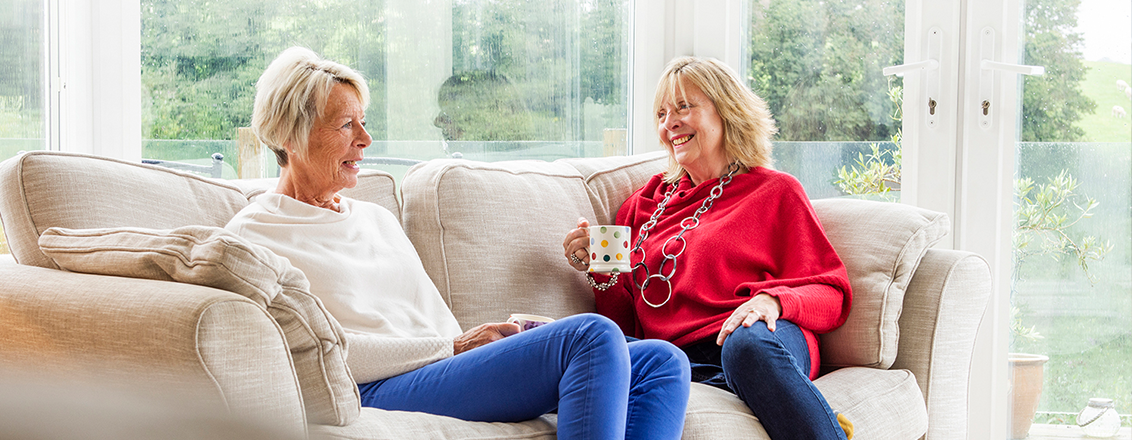 Two ladies wearing Issey Cornwall jumpers